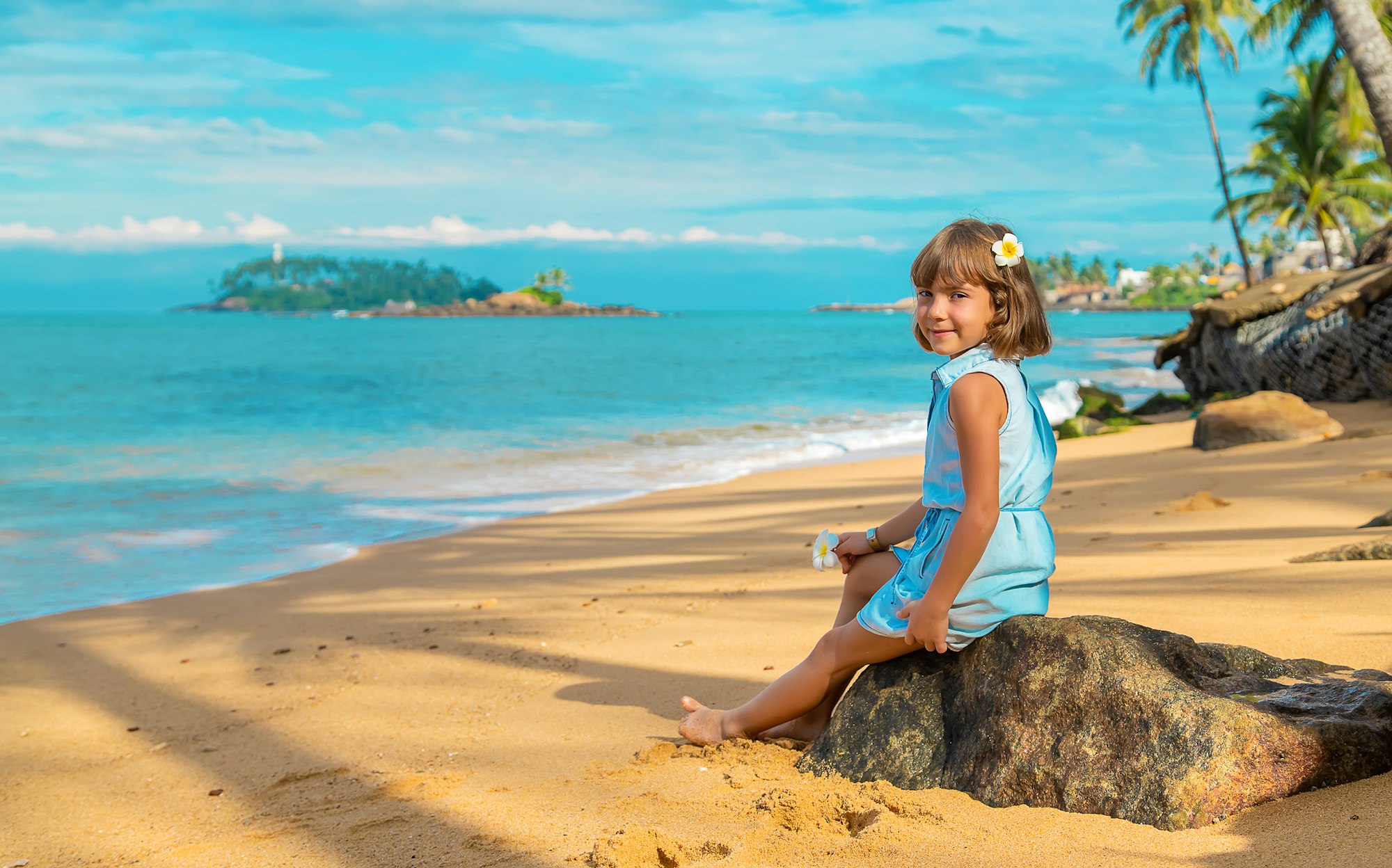 Child girl on the beach in Sri Lanka. Selective focus.